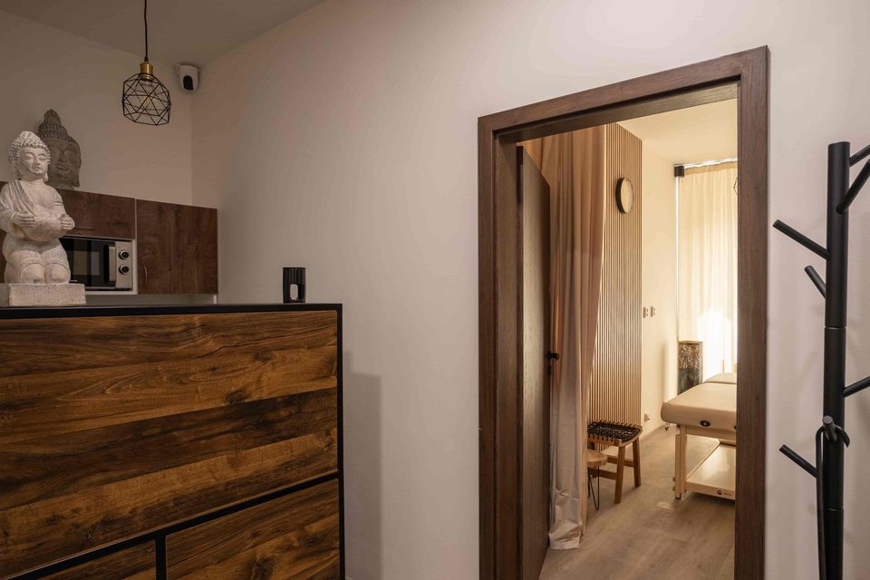 Salon reception with a view into the massage room